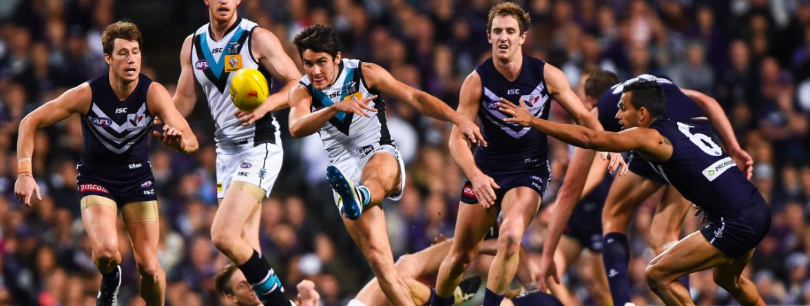 Chad Wingard of the Port Adelaide Power clears with a kick during the AFL 2014 First Semi Final match between the Fremantle Dockers and Port Adelaide Power at Patersons Stadium, Perth on September 13, 2014. (Photo: Daniel Carson/AFL Media)