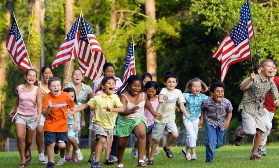 Children Running with American Flags --- Image by © Kevin Dodge/Corbis