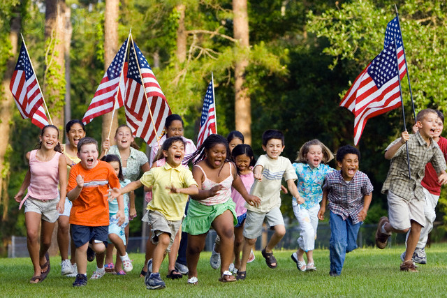 Children Running with American Flags --- Image by © Kevin Dodge/Corbis
