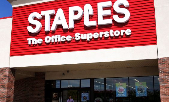 MOUNT PROSPECT, IL - SEPTEMBER 29:  A shopper departs a Staples store September 29, 2005 in Mount Prospect, Illinois. Staples is the first large chain store to begin recycling discarded electronic items, including old cell phones, pagers, portable handheld devices and used printer-ink cartridges.  (Photo by Tim Boyle/Getty Images)