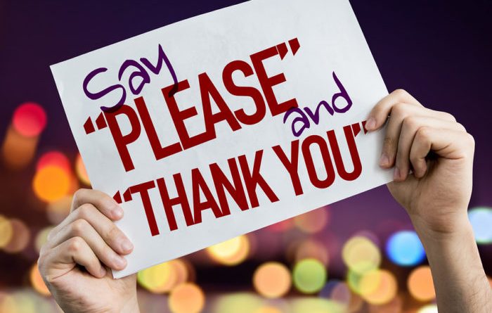 Say "Please" and "Thank You" placard with night lights on background